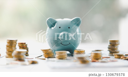 Money box filled with coins, saving cash, banking wisely, making sound investments can build financial wealth, personal finance and overall economy through proper business and currency management. Money box filled with coins, saving cash, banking wisely, making sound investments can build financial wealth, personal finance and overall economy through proper business and currency management. 130679378