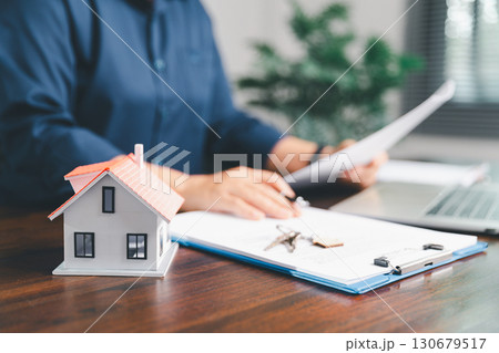 Female hand holds small miniature toy house, symbolizing woman dream of moving into her own home-real estate concept represents property investment, mortgage planning, insurance for secure future. Female hand holds small miniature toy house, symbolizing woman dream of moving into her own home-real estate concept represents property investment, mortgage planning, insurance for secure future. 130679517
