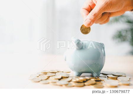 Businesswoman focused on saving money, smart financial planning, using banking, investment strategies to grow business, build wealth, achieve success while contributing to overall economy growth. Businesswoman focused on saving money, smart financial planning, using banking, investment strategies to grow business, build wealth, achieve success while contributing to overall economy growth. 130679877