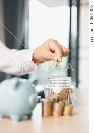 Hand holding coin symbolizes saving, investment, smart finance decisions money, currency, cash financial wealth, driving business growth, economic stability, long-term success in banking economy. Hand holding coin symbolizes saving, investment, smart finance decisions money, currency, cash financial wealth, driving business growth, economic stability, long-term success in banking economy. 130679878