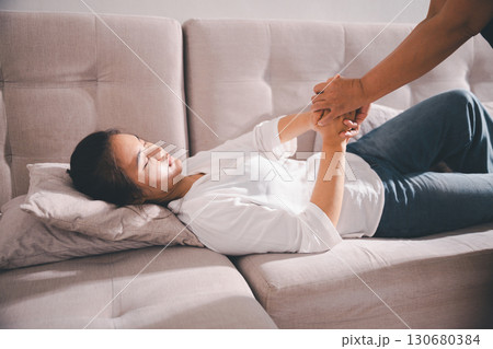 Moment of deep grief, sorrow and anxiety, lonely person overwhelmed by despair feels spark of hope when helping hand reaches out with genuine emotion to ease their problem. Moment of deep grief, sorrow and anxiety, lonely person overwhelmed by despair feels spark of hope when helping hand reaches out with genuine emotion to ease their problem. 130680384