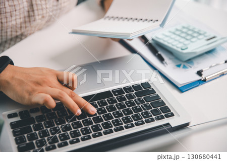 Businesswoman analysis with financial data, marketing business strategy project, Business financing accounting banking concept, finances, calculate about cost to real estate investment, tax system. Businesswoman analysis with financial data, marketing business strategy project, Business financing accounting banking concept, finances, calculate about cost to real estate investment, tax system. 130680441
