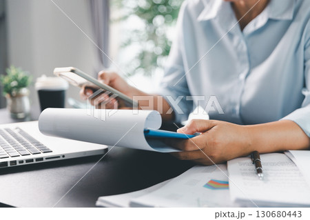 Business person with contract law and paper work for business finance, loan application form, contract real estate and insurance concept. signing contract, working on desk, business document Business person with contract law and paper work for business finance, loan application form, contract real estate and insurance concept. signing contract, working on desk, business document 130680443