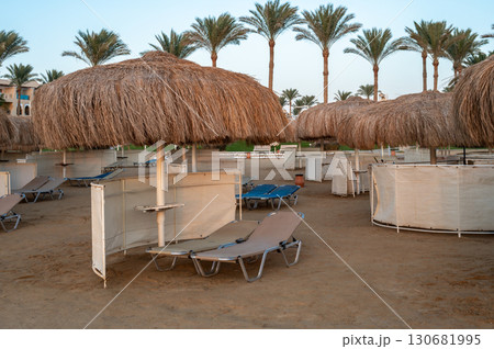 Row of Thatched Umbrellas on Marsa Alam Beach 130681995