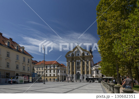 Ljubljana, Slovenia - August 15, 2019: Congress Square and the Ursulin Church of the Holy Trinity in Ljubljana Ljubljana, Slovenia - August 15, 2019: Congress Square and the Ursulin Church of the Holy Trinity in Ljubljana 130682351