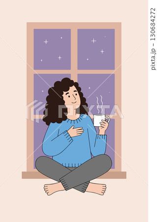 Woman enjoying coffee by the window at night Woman enjoying coffee by the window at night 130684272