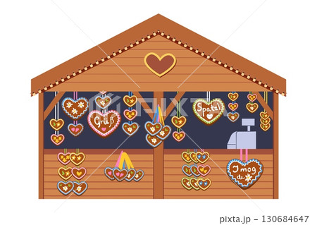 Oktoberfest market stall with hanging heart shaped gingerbread cookies decorated with icing and German love messages 130684647