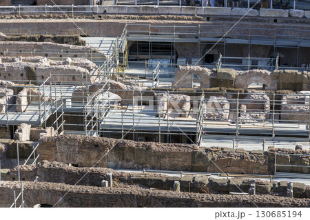 Rome, Italy - August 17, 2019: Building structures for the restoration of the Coliseum Rome, Italy - August 17, 2019: Building structures for the restoration of the Coliseum 130685194
