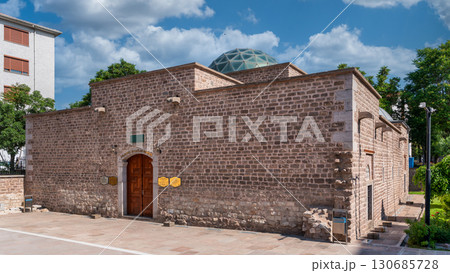 Gelenekli Sanatlar Merkezi, or Traditional Arts Center, a stone building with a modern glass dome, in Konya, Turkey 130685728