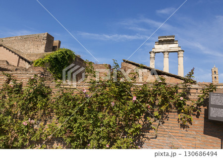 Rome, Italy - August 17, 2019: Three columns of the Temple of Dioscuri - one of the oldest temples in the Roman Forum Rome, Italy - August 17, 2019: Three columns of the Temple of Dioscuri - one of the oldest temples in the Roman Forum 130686494