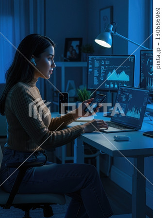 Young Professional Seamlessly Integrating AI and Smart Home Technology into Daily Work Life 130686969