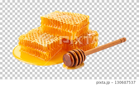 Close-up of golden honey in glass jar and natural honeycomb isolated on white background. 130687537