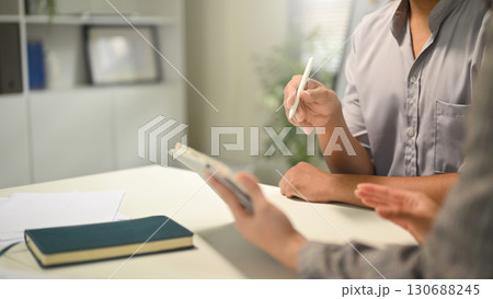 Close p of business professionals analyzing financial charts and graphs during a meeting Close p of business professionals analyzing financial charts and graphs during a meeting 130688245