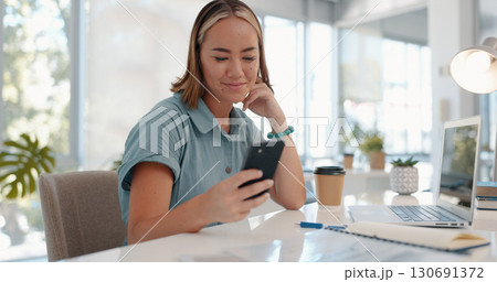 Phone, text and business woman in office with laptop and social media, chat or online dating notification. Smartphone, app and happy lady manager with internet, search or web, communication or email 130691372