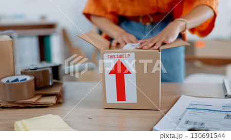 Box, packaging delivery with hands and courier, supplier and shipping, distribution from small business. Supply chain, logistics and inventory with e commerce, owner person pack parcel with service 130691544