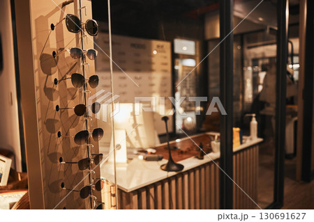 Sunglasses, fashion and retail with eyewear in an empty store after closing after hour for the night. Sale, display and product with a variety of glasses in a mall for shopping or consumerism Sunglasses, fashion and retail with eyewear in an empty store after closing after hour for the night. Sale, display and product with a variety of glasses in a mall for shopping or consumerism 130691627