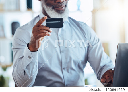 Black man hand, credit card or laptop for finance management, insurance or investment payment for future wealth policy. Smile, mature or CEO businessman on bank website, technology or online fintech Black man hand, credit card or laptop for finance management, insurance or investment payment for future wealth policy. Smile, mature or CEO businessman on bank website, technology or online fintech 130691639