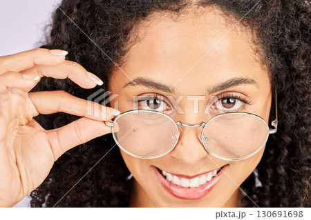 Cool, stylish and portrait of a woman with glasses isolated on studio background. Fashion, happy and face of a girl wearing fashionable eyewear for vision, eyecare and fancy eyeglasses on a backdrop Cool, stylish and portrait of a woman with glasses isolated on studio background. Fashion, happy and face of a girl wearing fashionable eyewear for vision, eyecare and fancy eyeglasses on a backdrop 130691698