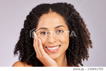 Black woman, portrait and spa beauty from skin glow and dermatology in a studio. Makeup, happiness and cosmetics of a young model with afro feeling happy from salon, facial and wellness treatment Black woman, portrait and spa beauty from skin glow and dermatology in a studio. Makeup, happiness and cosmetics of a young model with afro feeling happy from salon, facial and wellness treatment 130691705