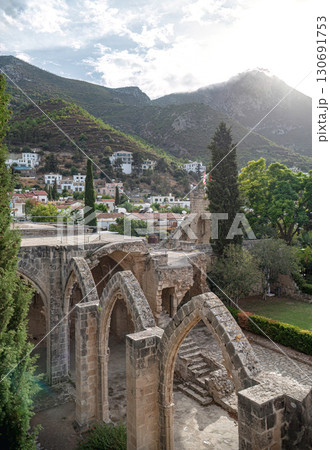 Bellapais Abbey ruins overlooking Bellapais village and Kyrenia mountains in Cyprus Bellapais Abbey ruins overlooking Bellapais village and Kyrenia mountains in Cyprus 130691753
