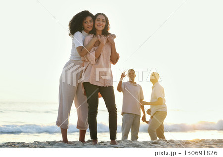 Embrace, portrait and mother and daughter at the beach for vacation, family walk and bonding. Sunset, love and elderly mom and woman hugging with affection while walking at ocean in summer for peace Embrace, portrait and mother and daughter at the beach for vacation, family walk and bonding. Sunset, love and elderly mom and woman hugging with affection while walking at ocean in summer for peace 130691826