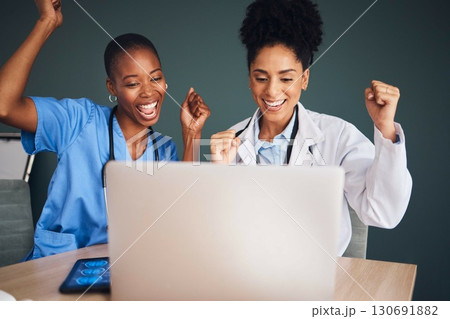 Laptop, black people or doctors in celebration of success for healthcare goals, achievement or hospital targets. Happy medical winners or nurses celebrating winning victory, good news or bonus deal 130691882