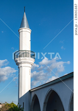 White minaret of Hamidiye Mosque standing tall in Pano Lefkara, Cyprus White minaret of Hamidiye Mosque standing tall in Pano Lefkara, Cyprus 130691887