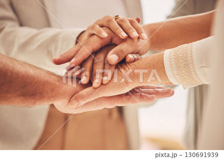 Business people, hands together and unity for goal or teamwork in trust, collaboration or support at office. Group piling hand in team building for cooperation, motivation or success in union Business people, hands together and unity for goal or teamwork in trust, collaboration or support at office. Group piling hand in team building for cooperation, motivation or success in union 130691939