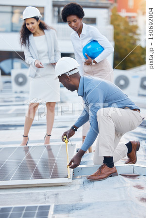 Black man, roof and solar panel installation team of construction worker technician outdoor. Businessman, renewable energy and industrial eco friendly panels of maintenance employee and handyman 130692004