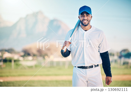Portrait, fitness and man with a bat, baseball and happiness on field, exercise and competition. Face, male athlete and player with sportswear, smile and confident guy for game, victory and mockup Portrait, fitness and man with a bat, baseball and happiness on field, exercise and competition. Face, male athlete and player with sportswear, smile and confident guy for game, victory and mockup 130692111