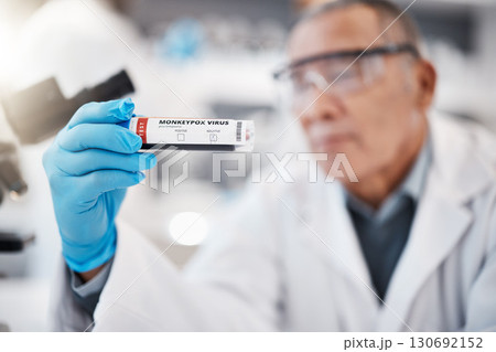 Test tube, science and scientist in laboratory for monkeypox for research, medical study and vaccine. Healthcare, pharmaceutical and hand with vial for lab test, virus sample and disease breakthrough Test tube, science and scientist in laboratory for monkeypox for research, medical study and vaccine. Healthcare, pharmaceutical and hand with vial for lab test, virus sample and disease breakthrough 130692152