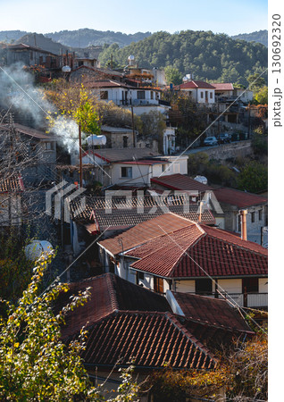 Smoke rising from chimney in picturesque Platanistasa village. Nicosia District, Cyprus Smoke rising from chimney in picturesque Platanistasa village. Nicosia District, Cyprus 130692320