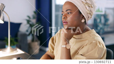 Thinking, business and black woman with ideas, planning and working on a digital proposal report. African person, employee and consultant in a workplace, copywriting and decision with inspiration Thinking, business and black woman with ideas, planning and working on a digital proposal report. African person, employee and consultant in a workplace, copywriting and decision with inspiration 130692711