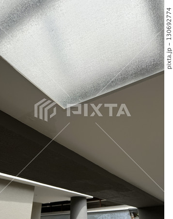 Frustrating water stain from leak in ceiling corner. Damage and dampness spread on wall, home repair problem needing immediate attention for mold prevention Frustrating water stain from leak in ceiling corner. Damage and dampness spread on wall, home repair problem needing immediate attention for mold prevention 130692774