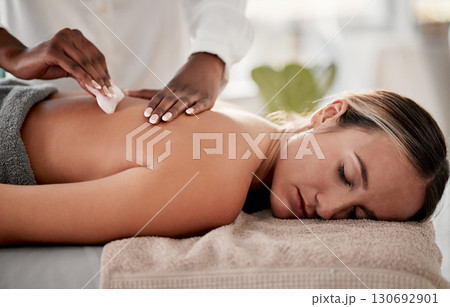 Spa, skincare and massage for woman with gua sha product for back pain, muscle and tension relief. Beauty salon, relax and girl with masseuse on a table with tool for spine, joint and inflammation 130692901