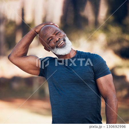 Senior man, stretching neck and exercise outdoor in nature forest for fitness and healthy lifestyle. Happy black person doing workout, training and muscle warm up for cardio body health and wellness 130692996