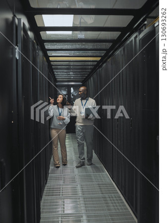 Laptop, teamwork or IT people in server room for maintenance, analysis or digital innovation. Data center, cybersecurity or man and woman programmer for planning network strategy or system firewall Laptop, teamwork or IT people in server room for maintenance, analysis or digital innovation. Data center, cybersecurity or man and woman programmer for planning network strategy or system firewall 130693262