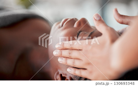Spa, face massage and black woman luxury for skincare wellness, peace and calm in beauty treatment. Facial therapist and hands for person zen, client healing and stress relief while relax or sleeping Spa, face massage and black woman luxury for skincare wellness, peace and calm in beauty treatment. Facial therapist and hands for person zen, client healing and stress relief while relax or sleeping 130693348
