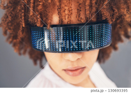 Fashion, cyberpunk and glasses with a black woman in studio on a gray background for futuristic style. Eyewear, future and modern with an attractive young female wearing a trendy or digital visor Fashion, cyberpunk and glasses with a black woman in studio on a gray background for futuristic style. Eyewear, future and modern with an attractive young female wearing a trendy or digital visor 130693395