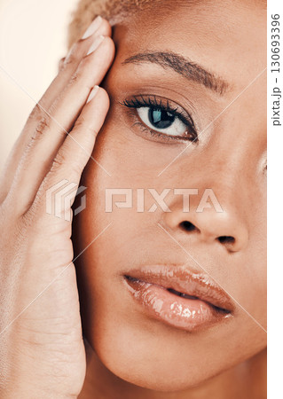 Beauty, hand on face and portrait of a black woman on brown background for dermatology cosmetics. Aesthetic model person in studio for skincare, makeup and facial glow with clean and healthy skin Beauty, hand on face and portrait of a black woman on brown background for dermatology cosmetics. Aesthetic model person in studio for skincare, makeup and facial glow with clean and healthy skin 130693396