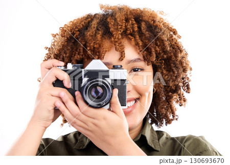 Camera, black woman and portrait of a young person taking a picture in a studio. Isolated, white background and photography shooting with a female feeling happiness with a smile from creativity 130693670