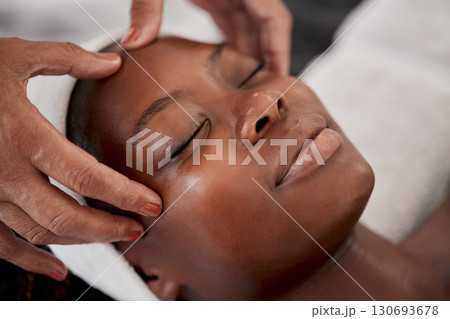 Black woman, relax face and luxury spa massage of a young female ready for facial. Skincare, beauty and wellness clinic with client feeling calm and zen from cosmetic chemical peel treatment 130693678