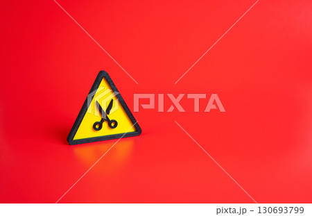 Spending or budget cutting scissors. Concept of cost reduction, austerity measures, and savings. Used for economic planning, government policy, and corporate budget control. Spending or budget cutting scissors. Concept of cost reduction, austerity measures, and savings. Used for economic planning, government policy, and corporate budget control. 130693799