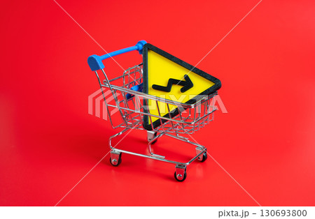 Symbol of falling in a shopping cart. Decline in consumer demand, rising prices, and inflation. Suitable for economy, family budgets, market instability, and purchasing power topics. Symbol of falling in a shopping cart. Decline in consumer demand, rising prices, and inflation. Suitable for economy, family budgets, market instability, and purchasing power topics. 130693800