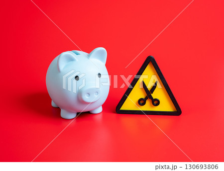 The budget is subject to cuts. Reduction of income and household savings. Concept of austerity, economic crisis, financial stress, and corporate downsizing. The budget is subject to cuts. Reduction of income and household savings. Concept of austerity, economic crisis, financial stress, and corporate downsizing. 130693806