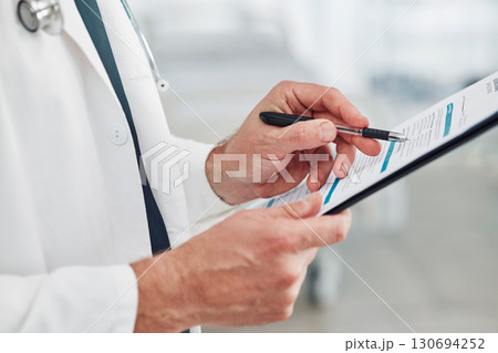 Doctor, reading or hands writing checklist for healthcare consulting, medical information or insurance detail. Nurse, medicine or worker on documents, wellness report planning or paper administration 130694252