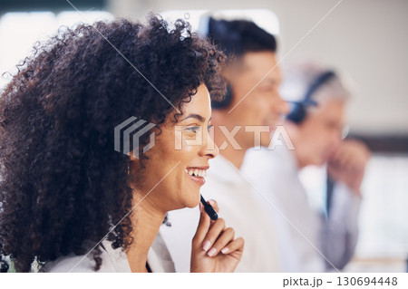 Smile, talking and black woman in a call center for consulting, help and communication. Contact, microphone and African customer support employee smiling for sales, advice and telemarketing work 130694448