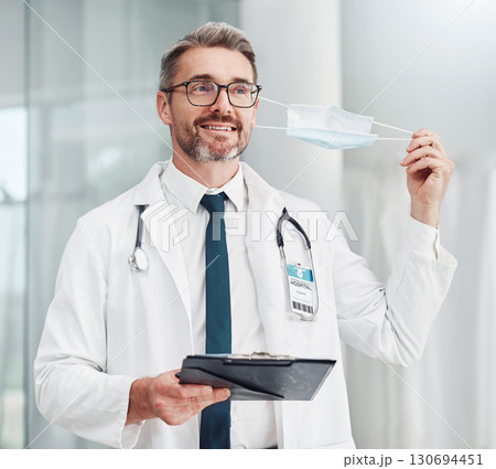 Covid, finished and doctor remove mask as corona end and ease on restrictions in a hospital or clinic with happy medical worker. Smile, done and healthcare professional leaving health centre Covid, finished and doctor remove mask as corona end and ease on restrictions in a hospital or clinic with happy medical worker. Smile, done and healthcare professional leaving health centre 130694451