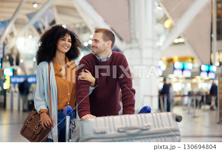 Travel, happy and love with interracial couple in airport for vacation, journey and transportation. Relax, smile and luggage with man and black woman on holiday trip for tourism, flight or departure Travel, happy and love with interracial couple in airport for vacation, journey and transportation. Relax, smile and luggage with man and black woman on holiday trip for tourism, flight or departure 130694804