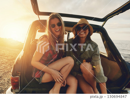 Women friends, portrait and car trunk on road trip, beach or relax on holiday for sunset with smile. Woman, outdoor and friendship happiness, ocean vacation or sunglasses for summer sunshine together Women friends, portrait and car trunk on road trip, beach or relax on holiday for sunset with smile. Woman, outdoor and friendship happiness, ocean vacation or sunglasses for summer sunshine together 130694847